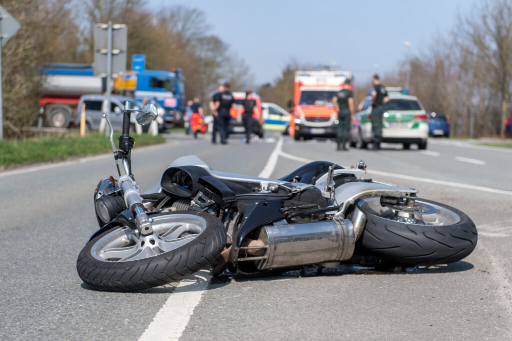 Motorcycle Traffic Accident: Broken Bike on the Street after Crash. Goodyear Motorcycle Accident Lawyers