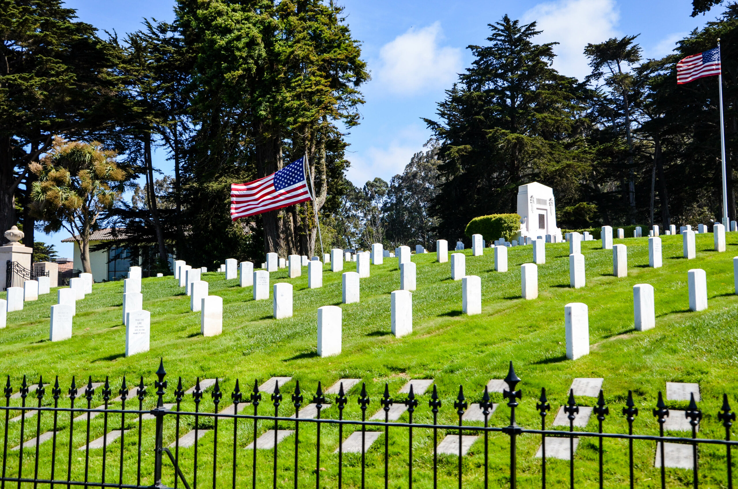 White graves on a hill with American flags - Amarillo wrongful death lawyers