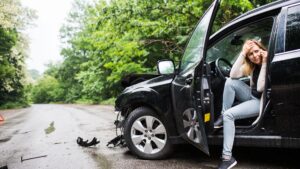 Woman talking on a phone after a car accident. Chandler Commercial Vehicle Accident Lawyers