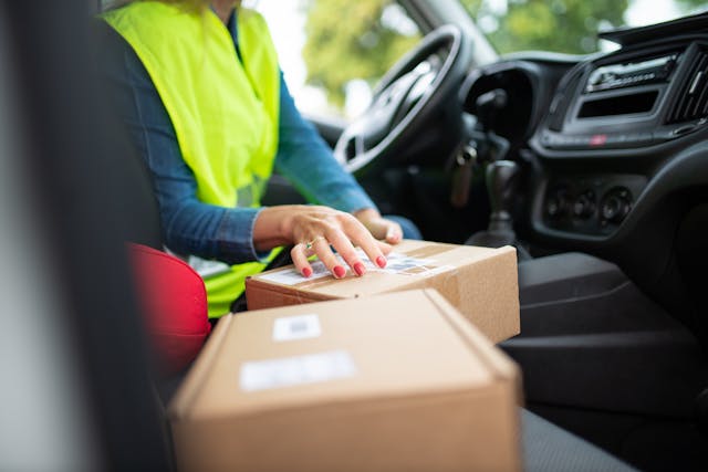 delivery driver with a parcel - Stockton Commercial Vehicle Accident Lawyers
